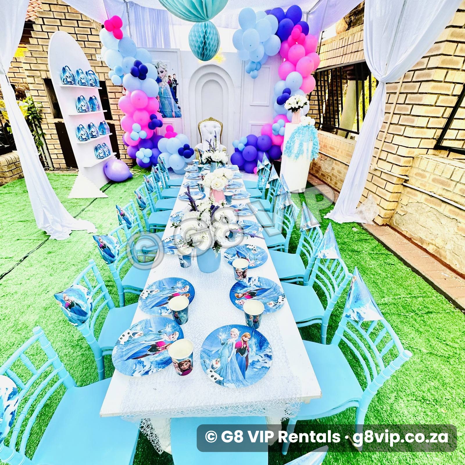 Blue decor range with balloon arch, blue chiavari chairs and styled table setting