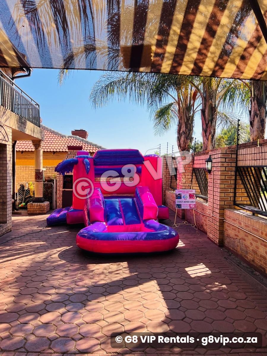 Purple Pink Castle jumping castle with slide and pool - straight on