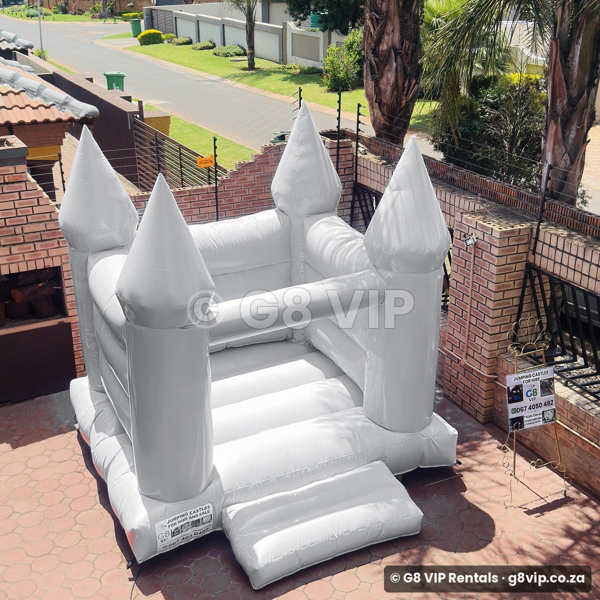 White Castle white jumping castle - front view