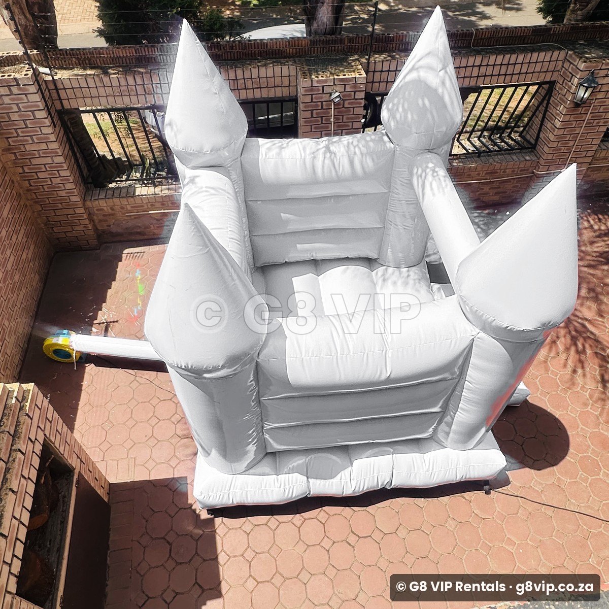 White Castle white jumping castle - back view